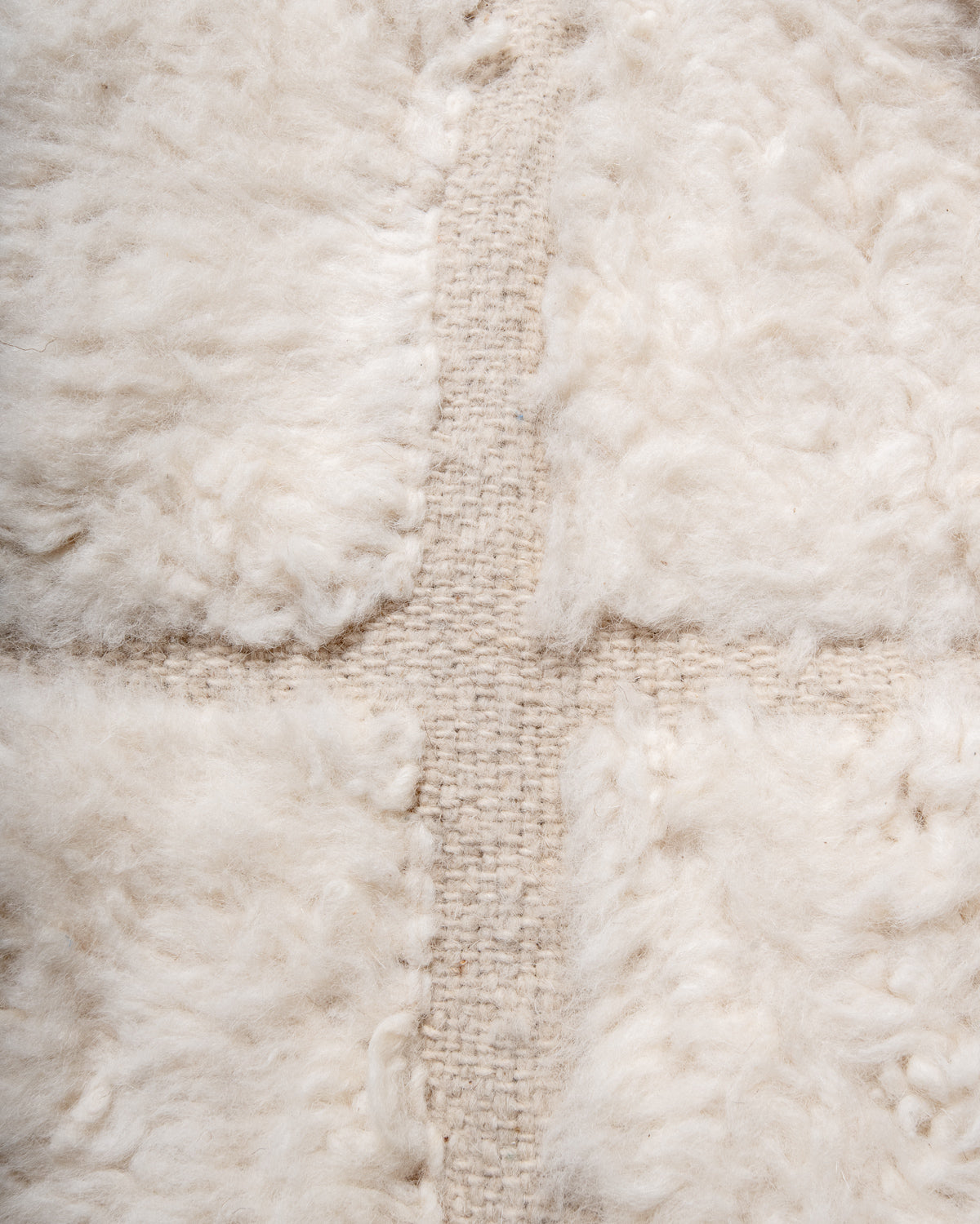 Modern, designer, handcrafted Berber rug from Morocco. Beniourain carpet with minimalist design, natural wool pile and a fluffy texture.